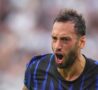 L'urlo di Calhanoglu dopo il gol alla Juve